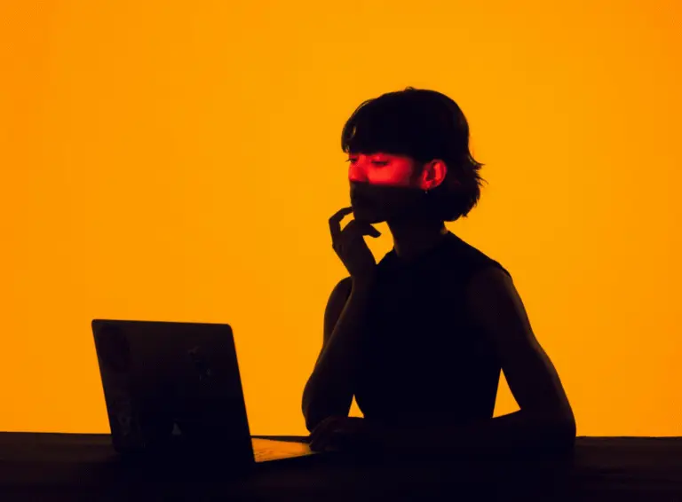 Orange background thinking lady